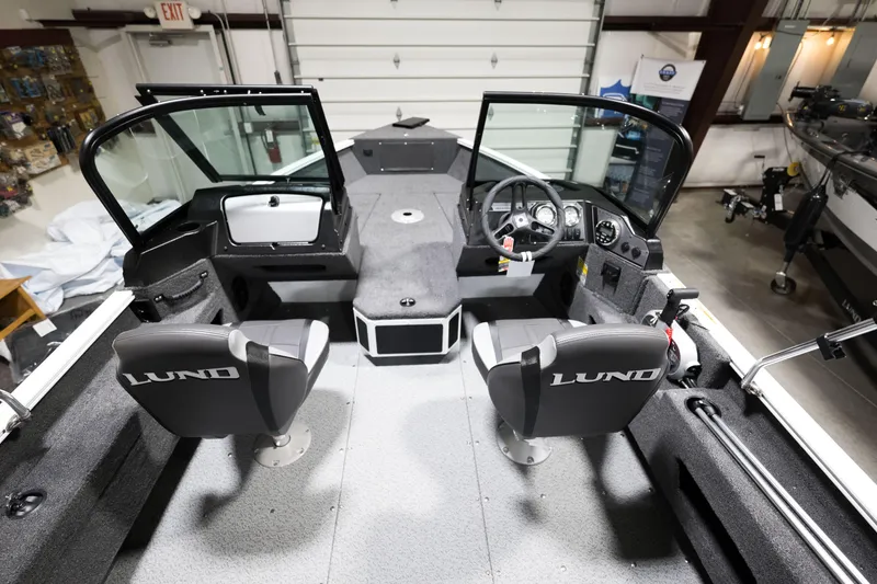 Slide: The Image of 2024 Lund 1675 Adventure Sport boat interior with dual seats and control console. - 18