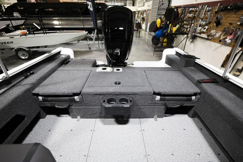 Slide: The Image of 2024 Lund 1675 Adventure Sport boat interior with motor and storage compartments. - 22