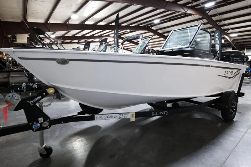 Slide: The Image of 2024 Lund 1675 Adventure Sport boat on trailer in indoor showroom. - 4