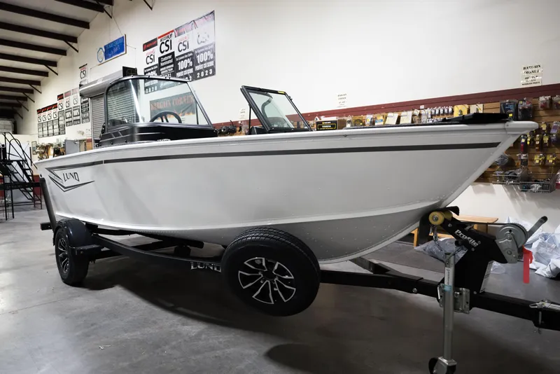 Slide: The Image of 2024 Lund 1675 Adventure Sport boat on trailer in showroom. - 5