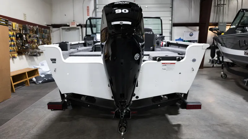 Slide: The Image of 2024 Lund 1675 Adventure Sport boat with Mercury 90 outboard motor in showroom. - 7