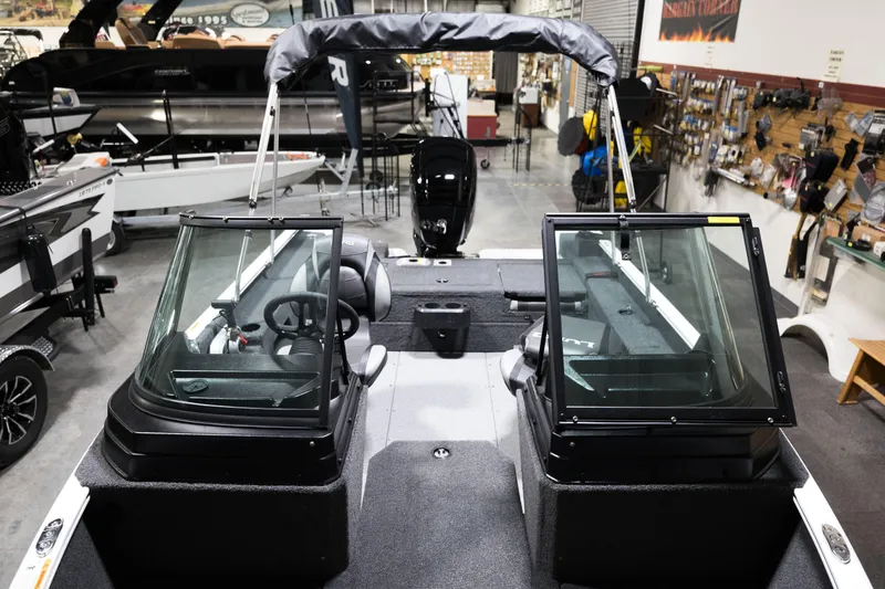 Slide: The Image of 2024 Lund 1675 Adventure Sport boat interior in showroom. - 9