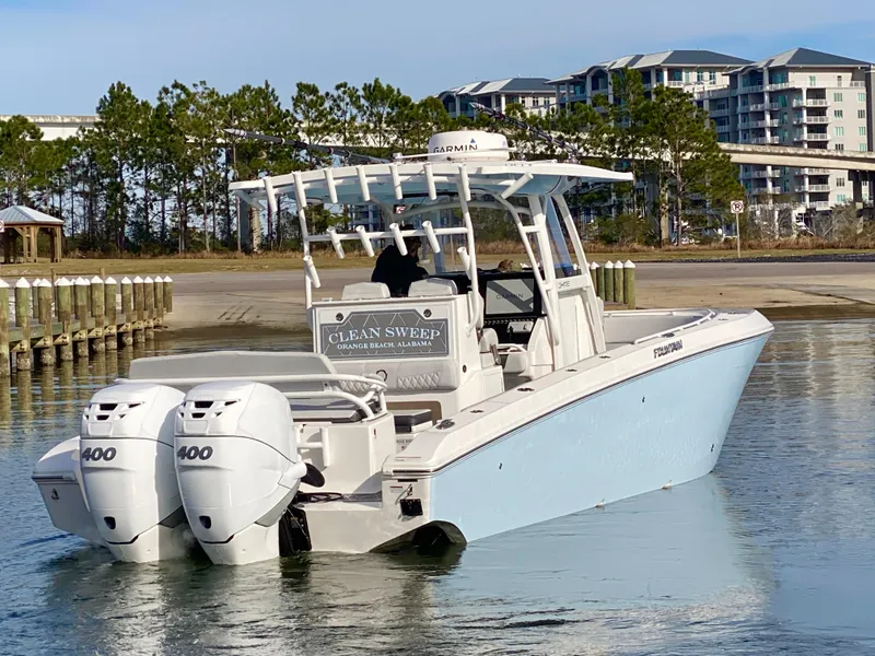 Slide: The Image of 2022 Fountain 34 Tournament Edition boat with twin 400 engines on calm water. - 10