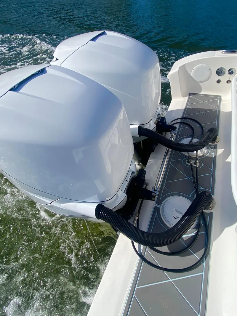 Slide: The Image of 2022 Fountain 34 Tournament Edition boat with dual outboard engines on water. - 18