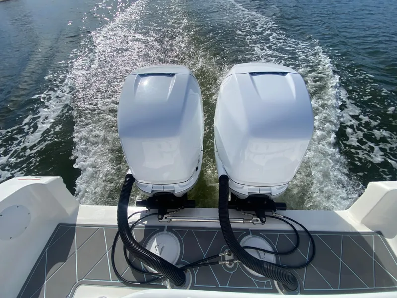Slide: The Image of 2022 Fountain 34 Tournament Edition boat with dual outboard motors on water. - 19