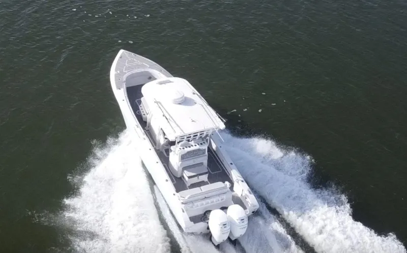 Slide: The Image of 2022 Fountain 34 Tournament Edition boat cruising on open water. - 2