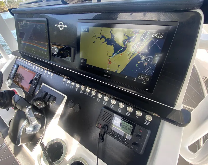 Slide: The Image of Close-up of the 2022 Fountain 34 Tournament Edition boat's navigation and control panel. - 21