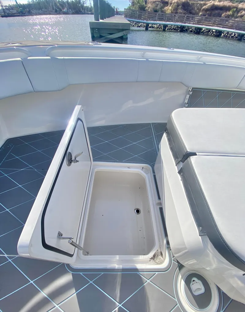 Slide: The Image of 2022 Fountain 34 Tournament Edition boat with open storage compartment. - 28