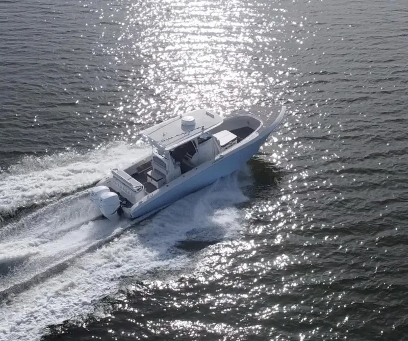 Slide: The Image of 2022 Fountain 34 Tournament Edition boat cruising on open water. - 3