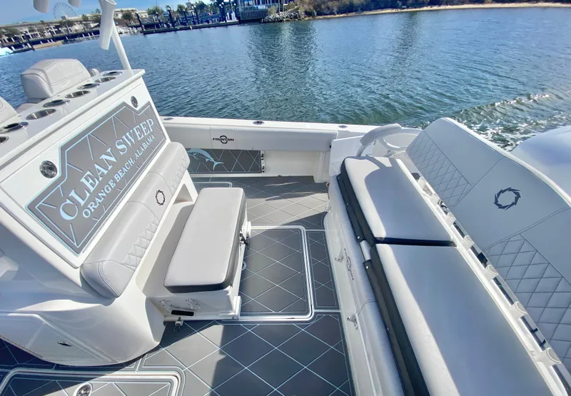 Slide: The Image of 2022 Fountain 34 Tournament Edition boat interior with seating and water view. - 30