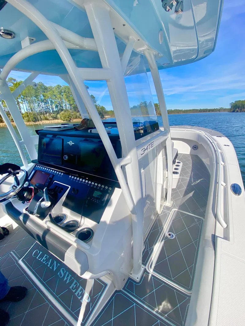 Slide: The Image of 2022 Fountain 34 Tournament Edition boat on a serene lake. - 31