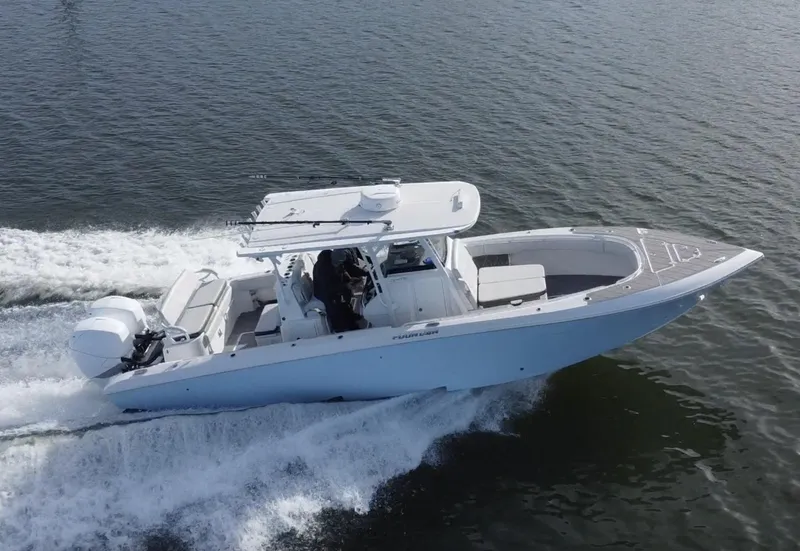 Slide: The Image of 2022 Fountain 34 Tournament Edition boat cruising on water. - 4