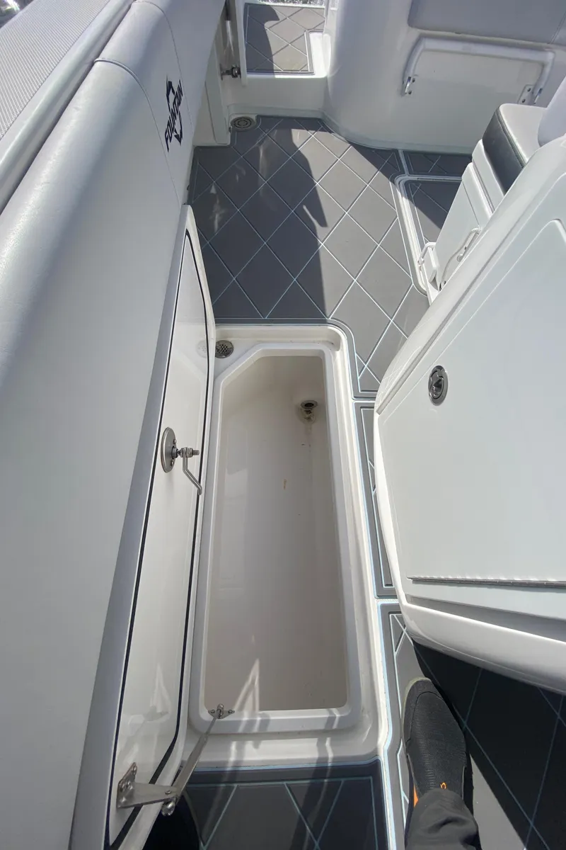 Slide: The Image of 2022 Fountain 34 Tournament Edition boat interior storage compartment. - 41