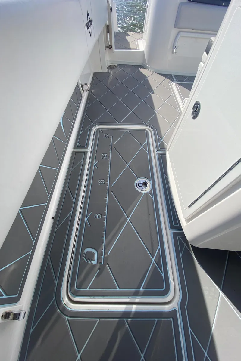 Slide: The Image of 2022 Fountain 34 Tournament Edition boat deck with custom flooring. - 42