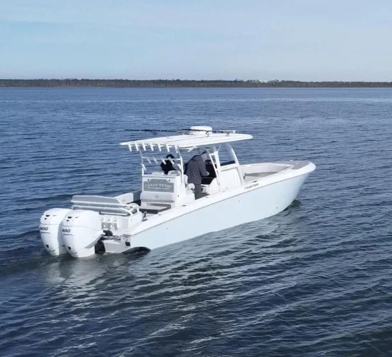 Slide: The Image of 2022 Fountain 34 Tournament Edition boat cruising on open water. - 7