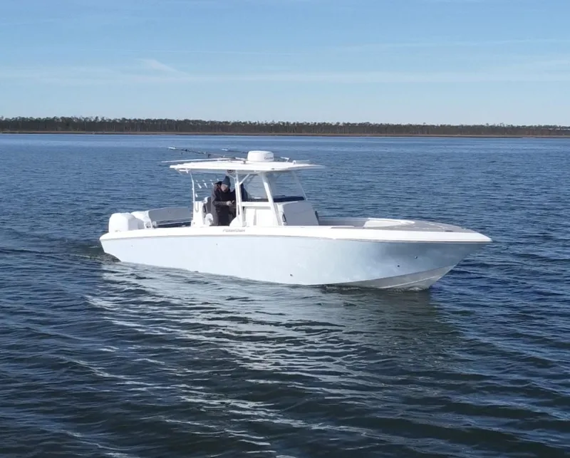 Slide: The Image of 2022 Fountain 34 Tournament Edition boat cruising on open water. - 8