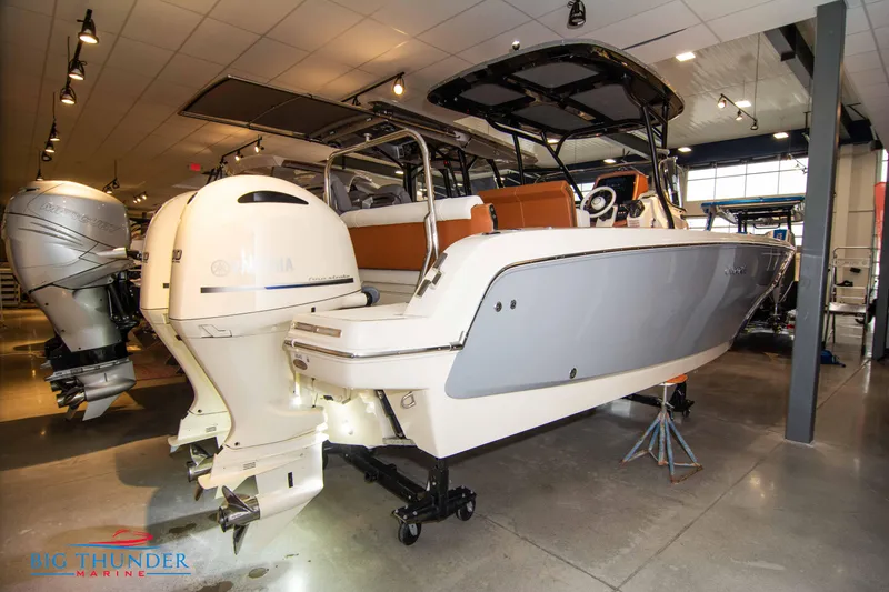 Slide: The Image of 2024 Capoforte FX270 boat on display in a showroom. - 12