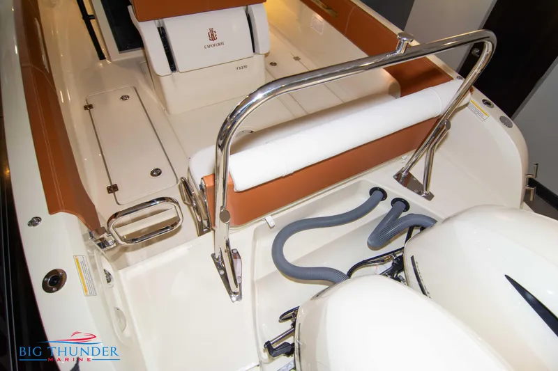 Slide: The Image of 2024 Capoforte FX270 boat interior with seating and engine compartment. - 18