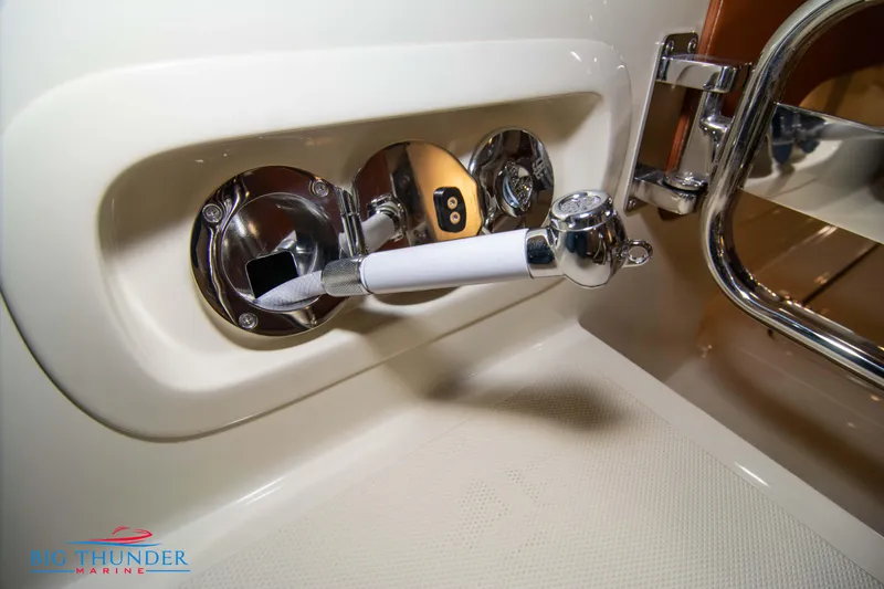 Slide: The Image of 2024 Capoforte FX270 boat interior detail with chrome fixtures and white handle. - 23