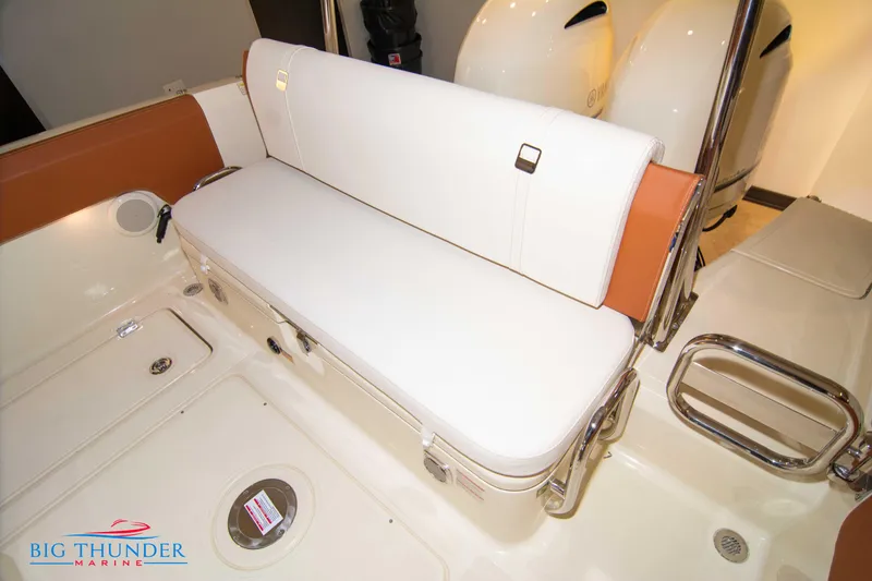 Slide: The Image of 2024 Capoforte FX270 boat seating area with white and brown upholstery. - 25