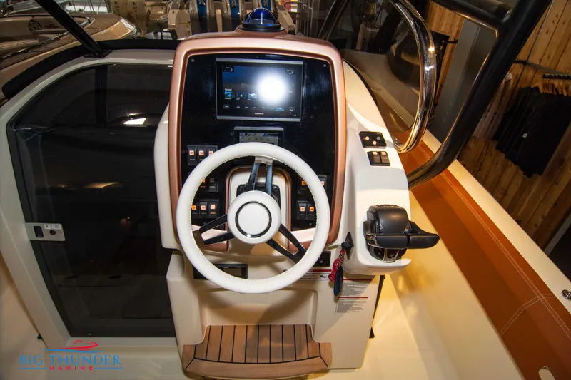 Slide: The Image of 2024 Capoforte FX270 boat helm with modern controls and touchscreen display. - 32