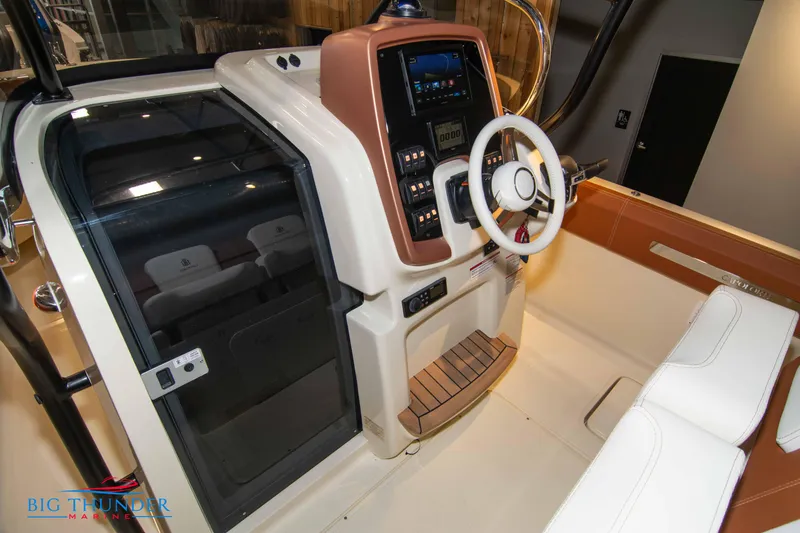 Slide: The Image of 2024 Capoforte FX270 boat cockpit with steering wheel and control panel. - 33