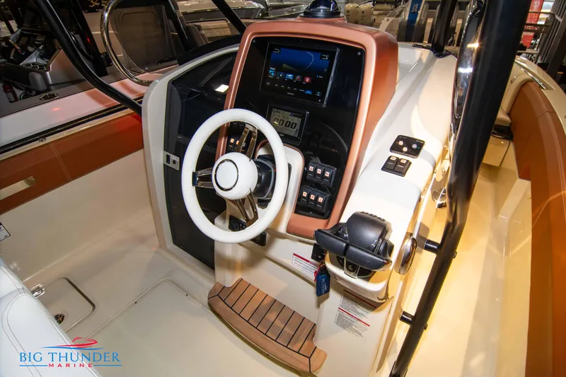 Slide: The Image of 2024 Capoforte FX270 boat helm with steering wheel and control panel. - 34