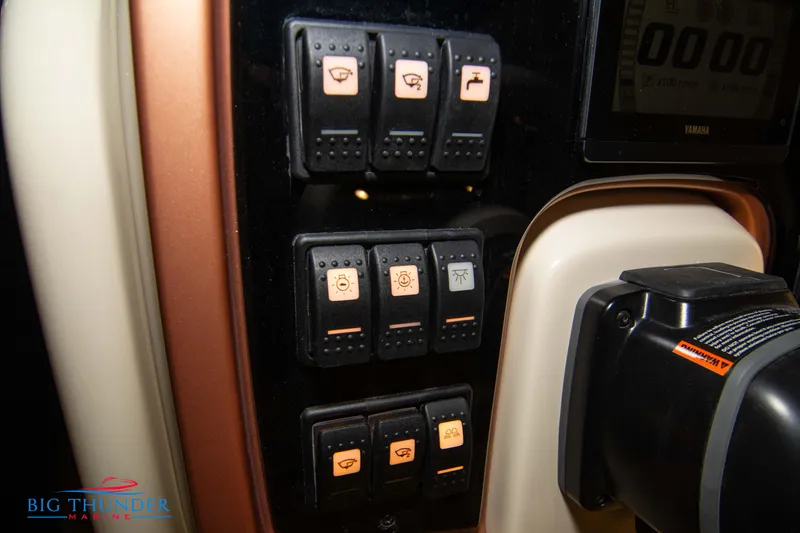 Slide: The Image of 2024 Capoforte FX270 control panel with illuminated switches and Big Thunder Marine logo. - 38