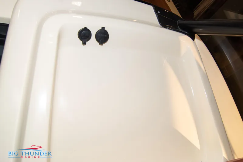 Slide: The Image of 2024 Capoforte FX270 boat interior detail with Big Thunder Marine logo. - 46