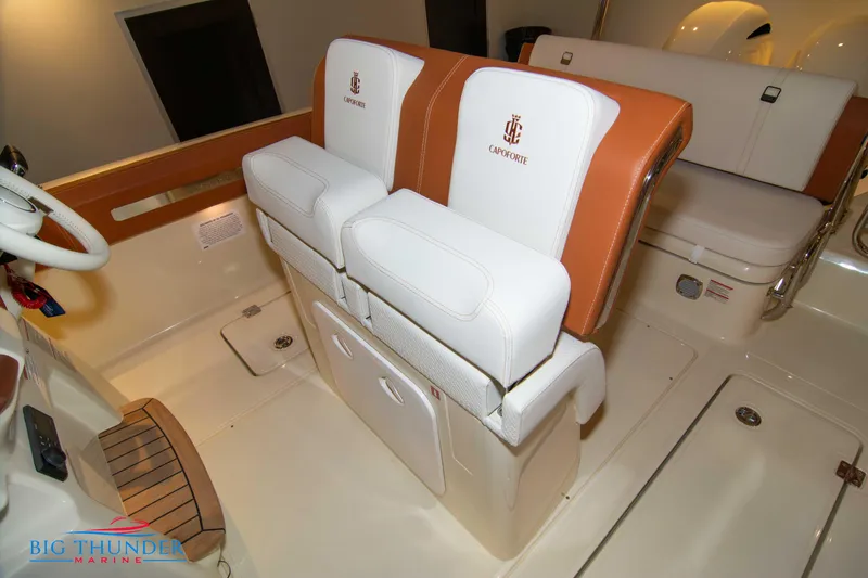 Slide: The Image of 2024 Capoforte FX270 boat interior with white and tan seating. - 47