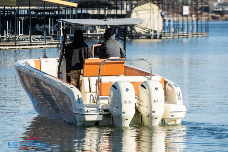 Slide: The Image of 2024 Capoforte FX270 boat with dual engines on a calm lake. - 6