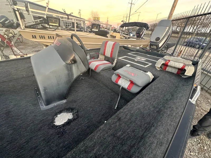 Slide: The Image of 1997 Xpress H51 boat interior with seats and steering console. - 4