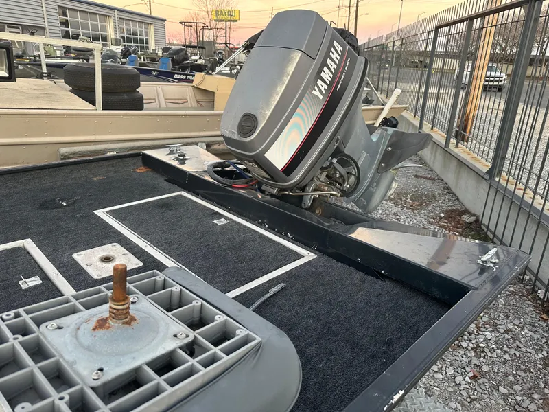 Slide: The Image of 1997 Xpress H51 boat with Yamaha outboard motor in a storage yard. - 5