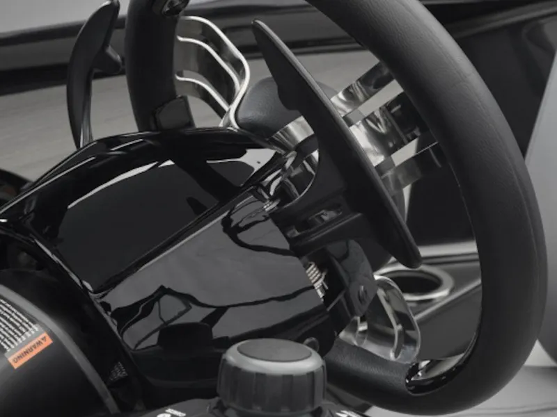 Slide: The Image of Close-up of the steering wheel and controls of a 2024 Yamaha Boats 222XD. - 2