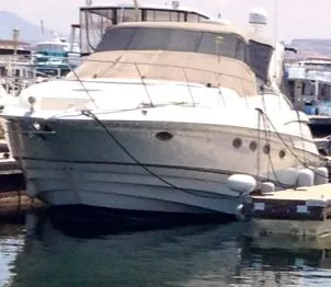 Slide: The Image of 2001 Regal 4160 Commodore yacht docked at marina. - 12