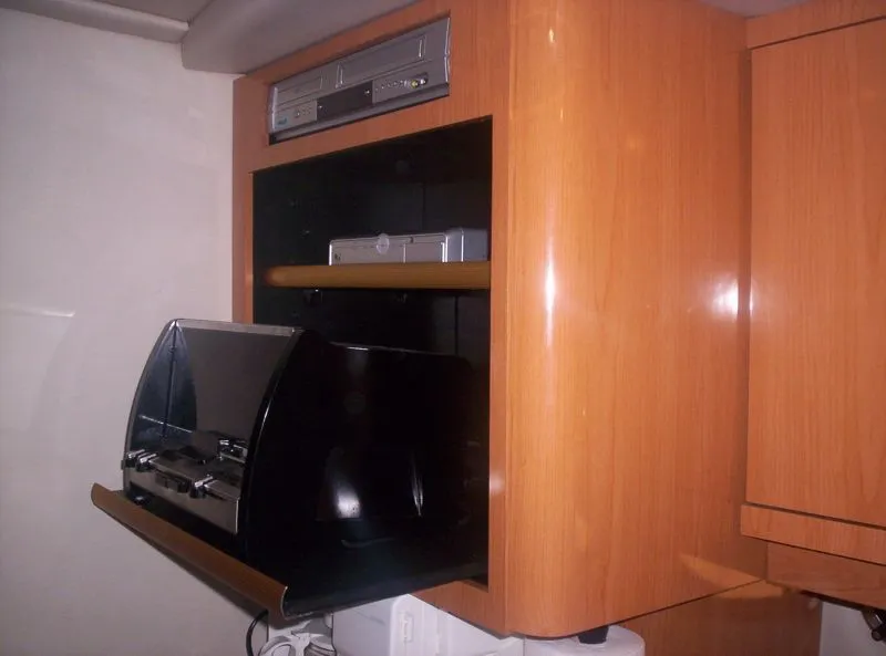 Slide: The Image of Built-in entertainment system in 2001 Regal 4160 Commodore yacht. - 15