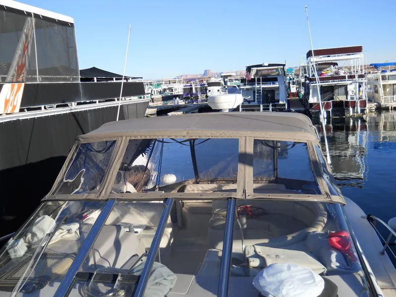 Slide: The Image of 2001 Regal 4160 Commodore yacht docked at a marina. - 17