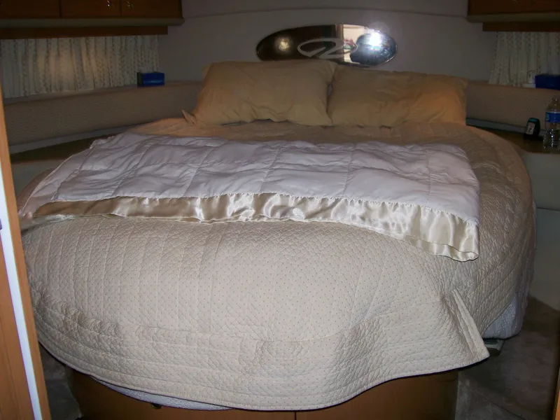 Slide: The Image of Luxurious bedroom in a 2001 Regal 4160 Commodore yacht with a cozy bed. - 18