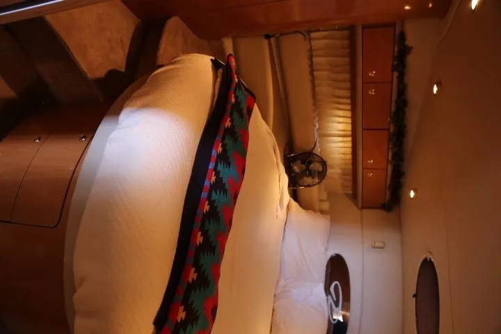 Slide: The Image of Interior cabin of a 2001 Regal 4160 Commodore yacht with cozy bed and decor. - 31