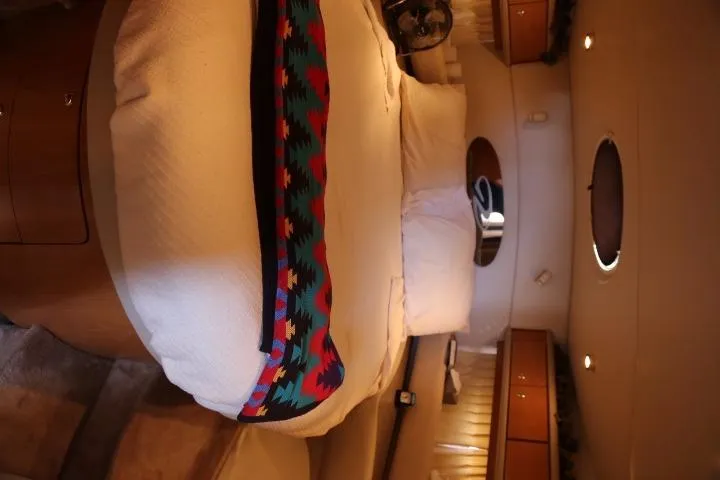 Slide: The Image of Interior cabin of a 2001 Regal 4160 Commodore yacht with a cozy bed. - 32