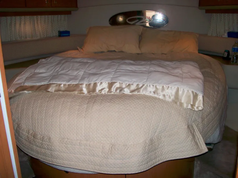 Slide: The Image of 2001 Regal 4160 Commodore yacht bedroom with beige bedding. - 36