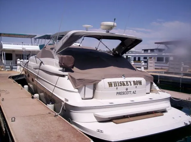 Slide: The Image of 2001 Regal 4160 Commodore yacht docked at a marina, named Whiskey Row, Prescott, AZ. - 9