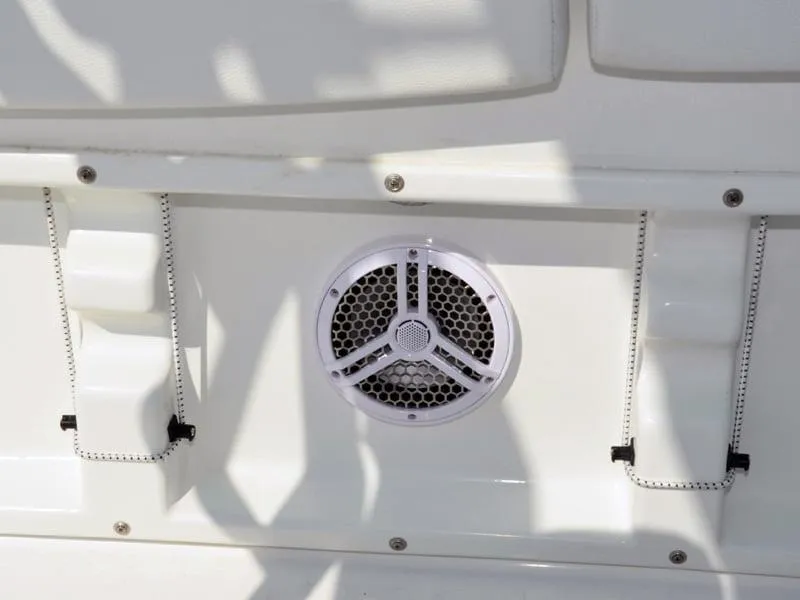 Slide: The Image of Close-up of a 2021 Clearwater 2305 CC boat speaker and seating area. - 18