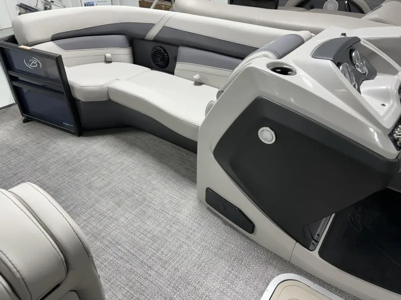 Slide: The Image of Interior of 2024 Barletta C22CC pontoon boat with luxurious seating and modern dashboard. - 12