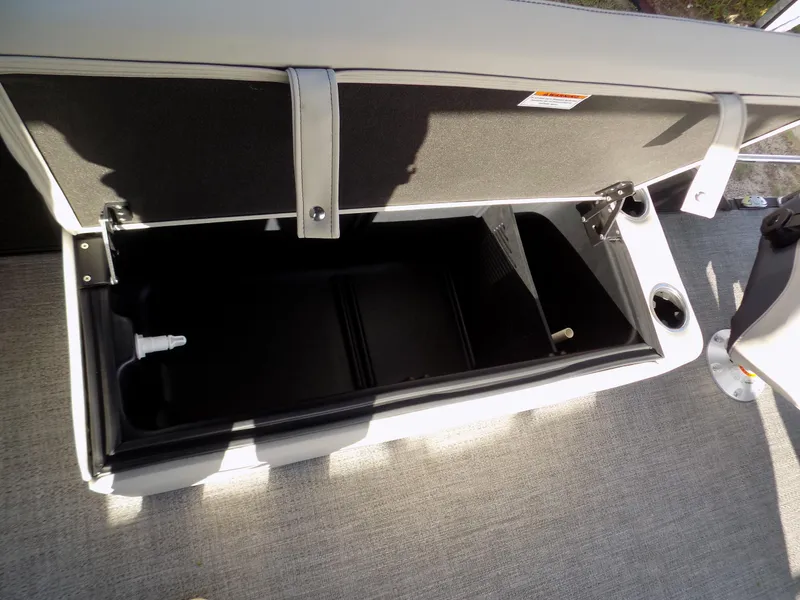 Slide: The Image of Open storage compartment in 2024 Barletta C22CC pontoon boat. - 17
