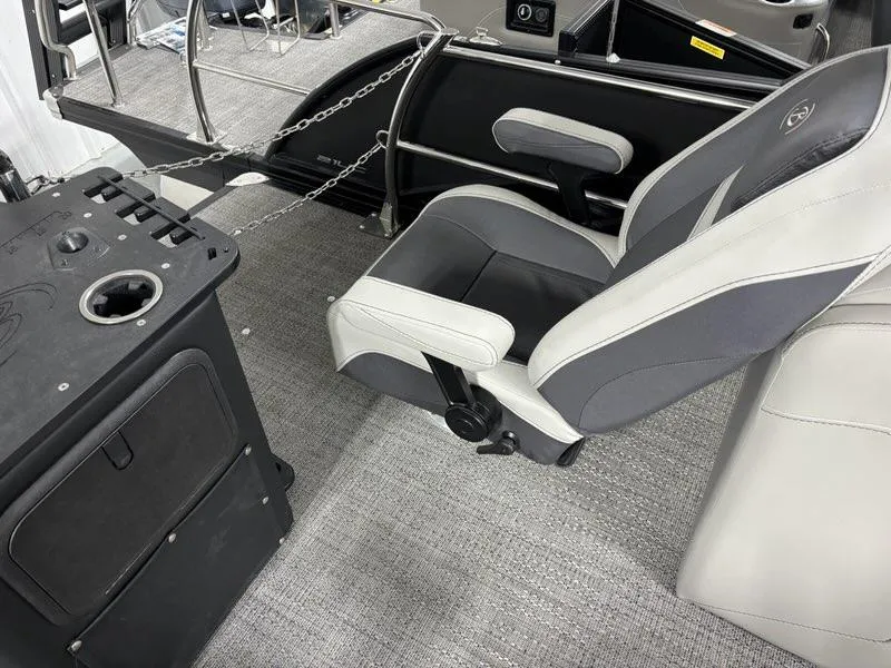Slide: The Image of 2024 Barletta C22CC boat interior with captain's chair and control console. - 7