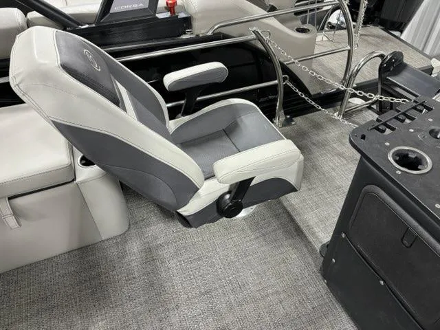 Slide: The Image of 2024 Barletta C22CC boat interior with captain's chair and console. - 8