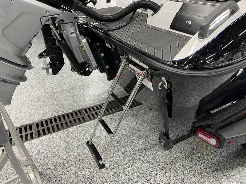 Slide: The Image of 2024 Vexus DVX 20S boat with a foldable ladder and outboard motor. - 10