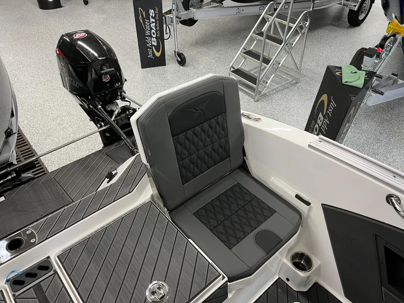 Slide: The Image of 2024 Vexus DVX 20S boat interior with black and gray seating. - 13