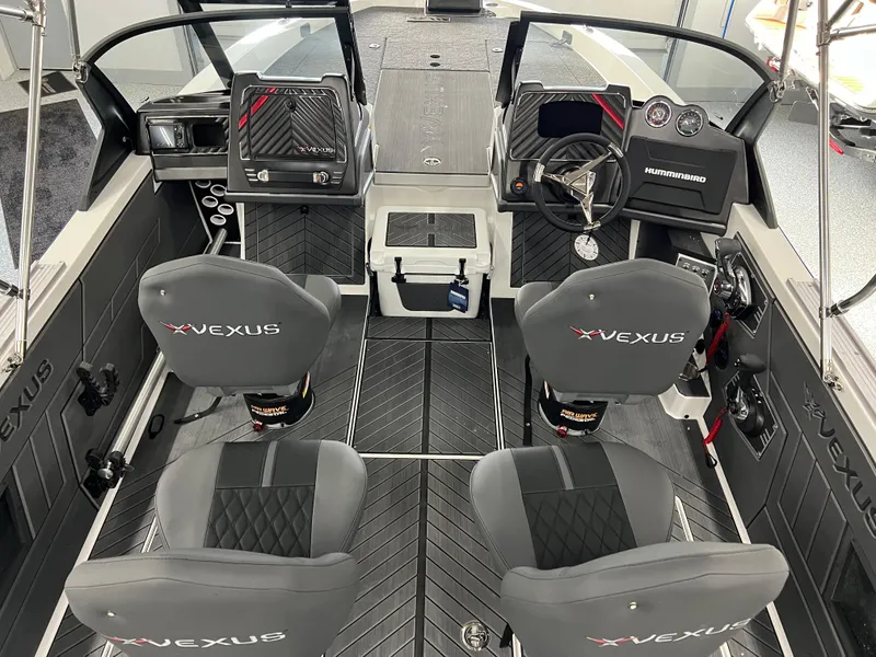Slide: The Image of 2024 Vexus DVX 20S boat interior with dual seats and advanced dashboard. - 14
